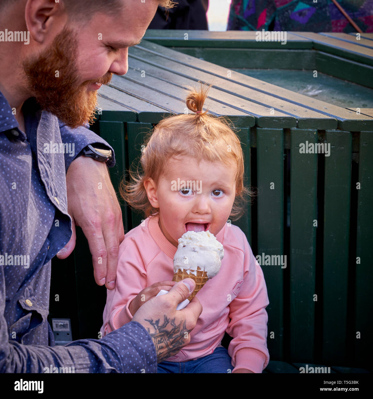 Young child enjoying an ice cream, Cultural Day, Summer Festival, Reykjavik, Iceland Stock Photo