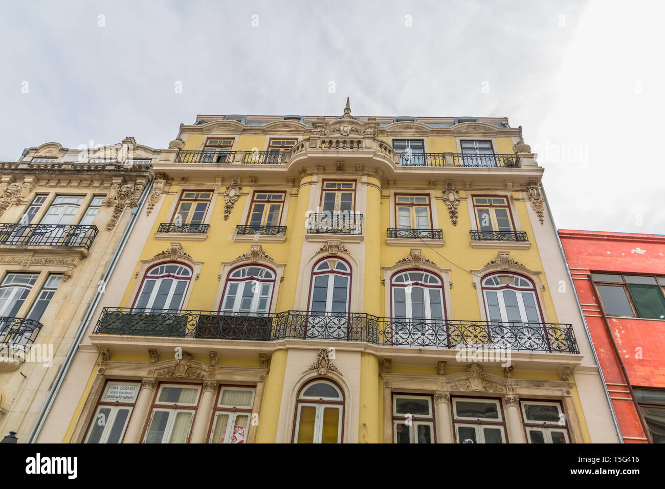 Coimbra / Portugal - 04 04 2019 : View of the exterior facade of a classic building, sky as background, in Coimbra city, Portugal Stock Photo