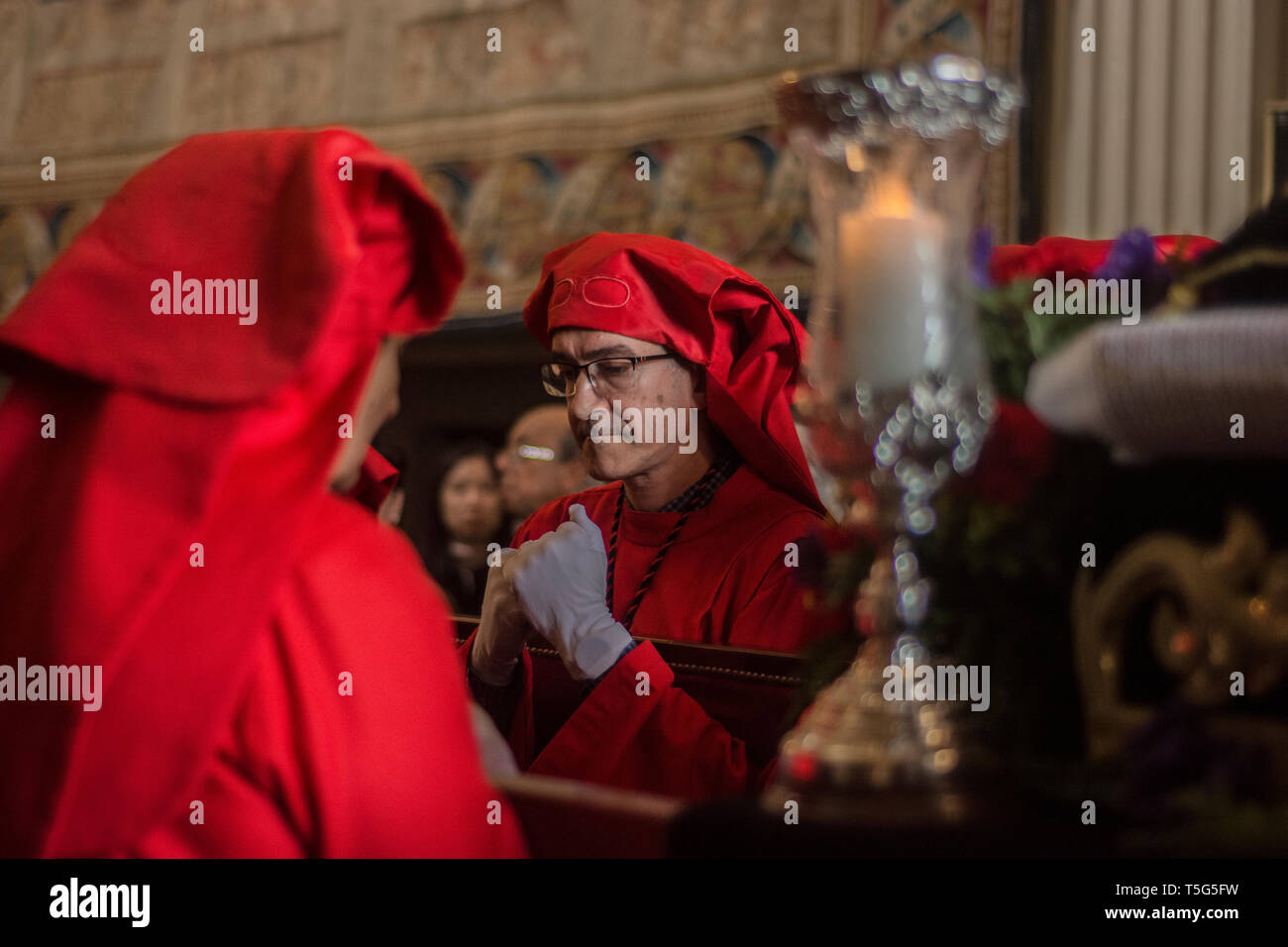 Men seen charging the christ in the royal monastery of the incarnation in Madrid, Spain. Stock Photo