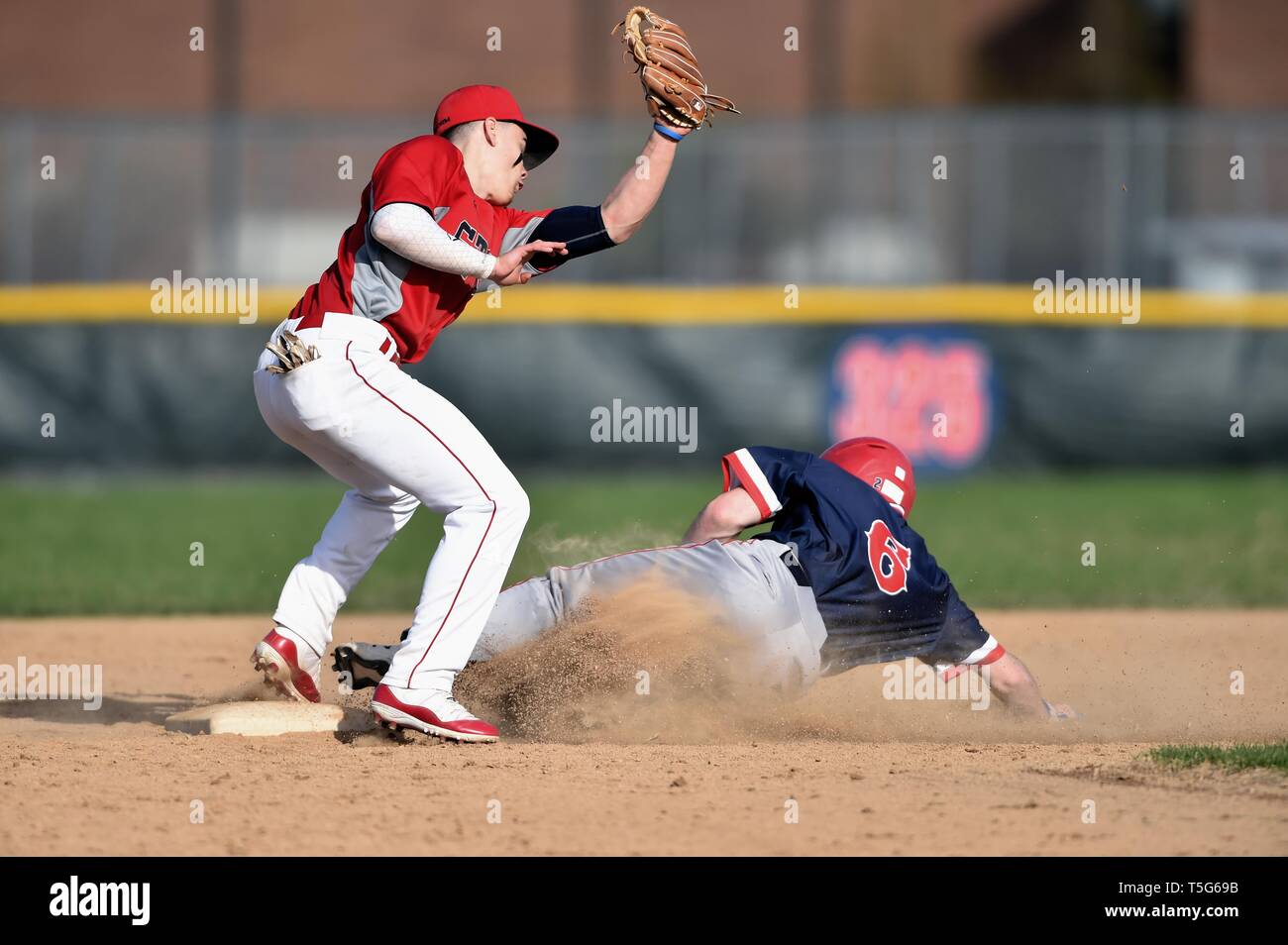 Shortstop allying a late swipe tag on a base runner that had just ...