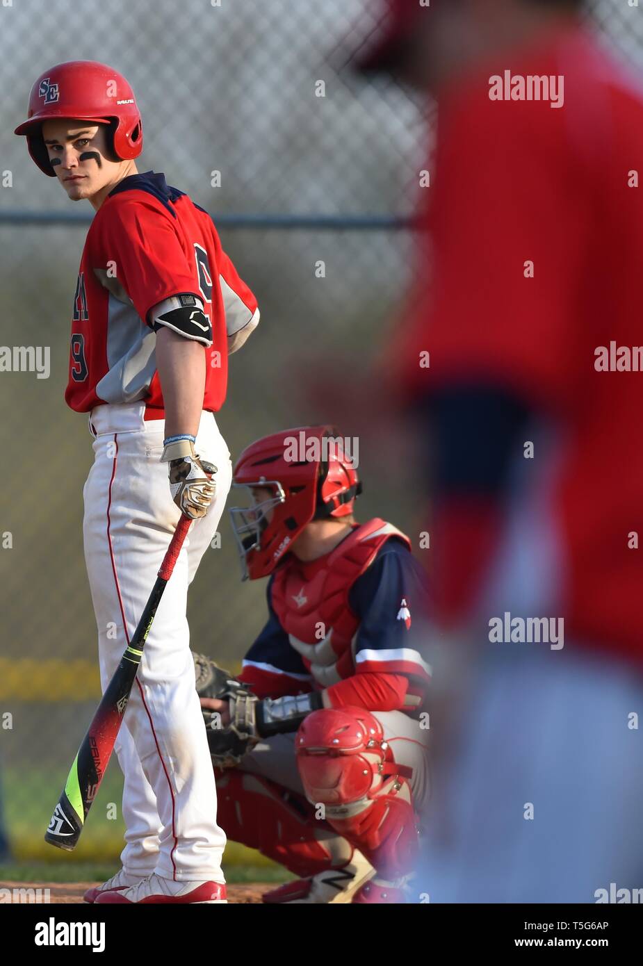 Batter stepping out of the batter's box to look for a sign from the