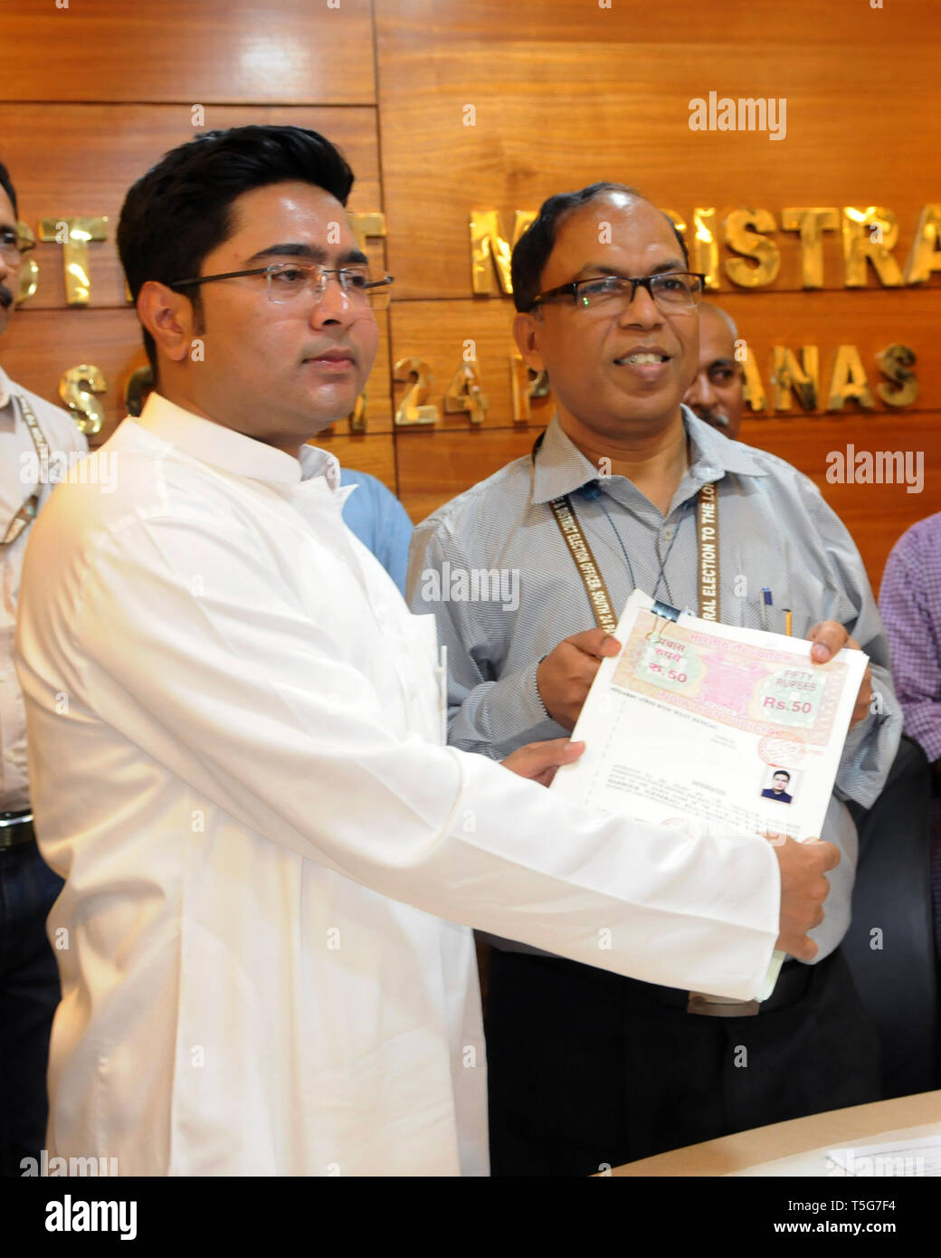 Kolkata, India. 24th Apr, 2019. Trinamool Congress or TMC candidate for Diamond Harbour constituency Abhishek Banerjee (left) submits his nomination papers for the Lok Sabha Election 2019. Credit: Saikat Paul/Pacific Press/Alamy Live News Stock Photo