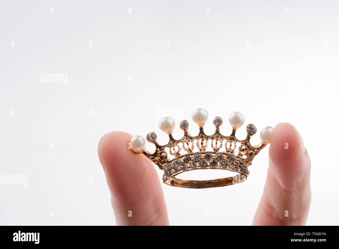 Golden color crown model with pearls on white background Stock Photo ...