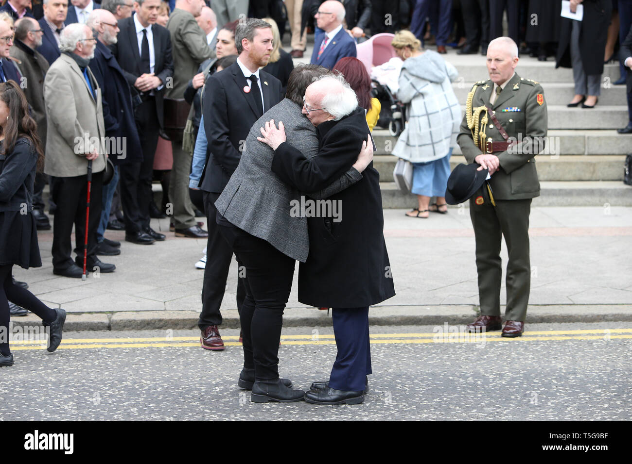 Belfast, County Antrim, Northern Ireland, 24th April, 2019 - Irish President Michael D. Higgins hugs Sara Canning, partner of Ms Lyra McKee, after Ms McKee's funeral at St Anne's Cathedral, Donegall Street, Belfast. Ms McKee,a Journalists, 29, was shot in the head on Thursday night while observing rioting in Londonderry's Creggan estate. The New IRA has admitted responsibility for the murder of journalist Lyra McKee. Paul McErlane/Alamy Live News Stock Photo