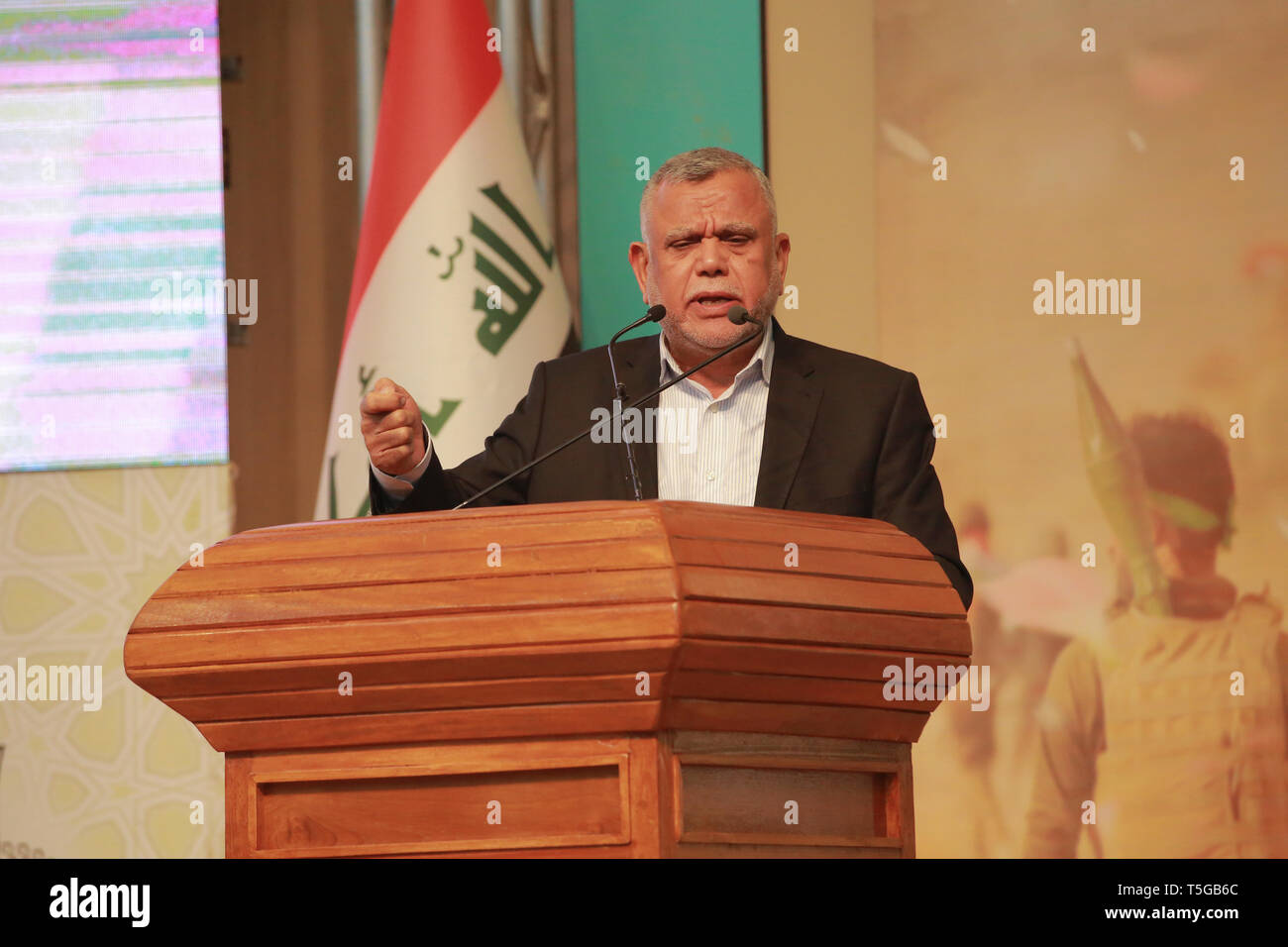 Baghdad, Iraq. 24th Apr, 2019. Hadi Al-Amiri, former Iraqi minister of transportation and Leader of the Fatah Alliance, speaks during a conference organized by the predominantly Shia Muslim Popular Mobilization Forces (PMF) to honour Iranian fighters who died fighting the so-called Islamic State (IS) terror group. Credit: Ameer Al Mohammedaw/dpa/Alamy Live News Stock Photo