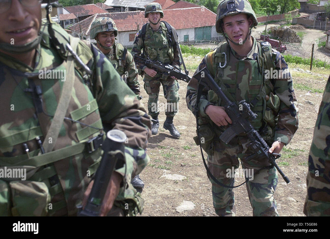 Mogila, Kosovo, Yugoslavia. 1st June, 2000. Soldiers with Bravo Company, 1st Battalion, 187th Infantry finish up a patrol in Mogila, Kosovo, Yugoslavia, June 1, 2000.The platoon was nicknamed Orange Crush lived in and patroled town from a 500-year old Serbian Orthodox Church.They constantly patroled and tried to keep the two ethnic groups from attacking each other. Credit: Bill Putnam/ZUMA Wire/Alamy Live News Stock Photo