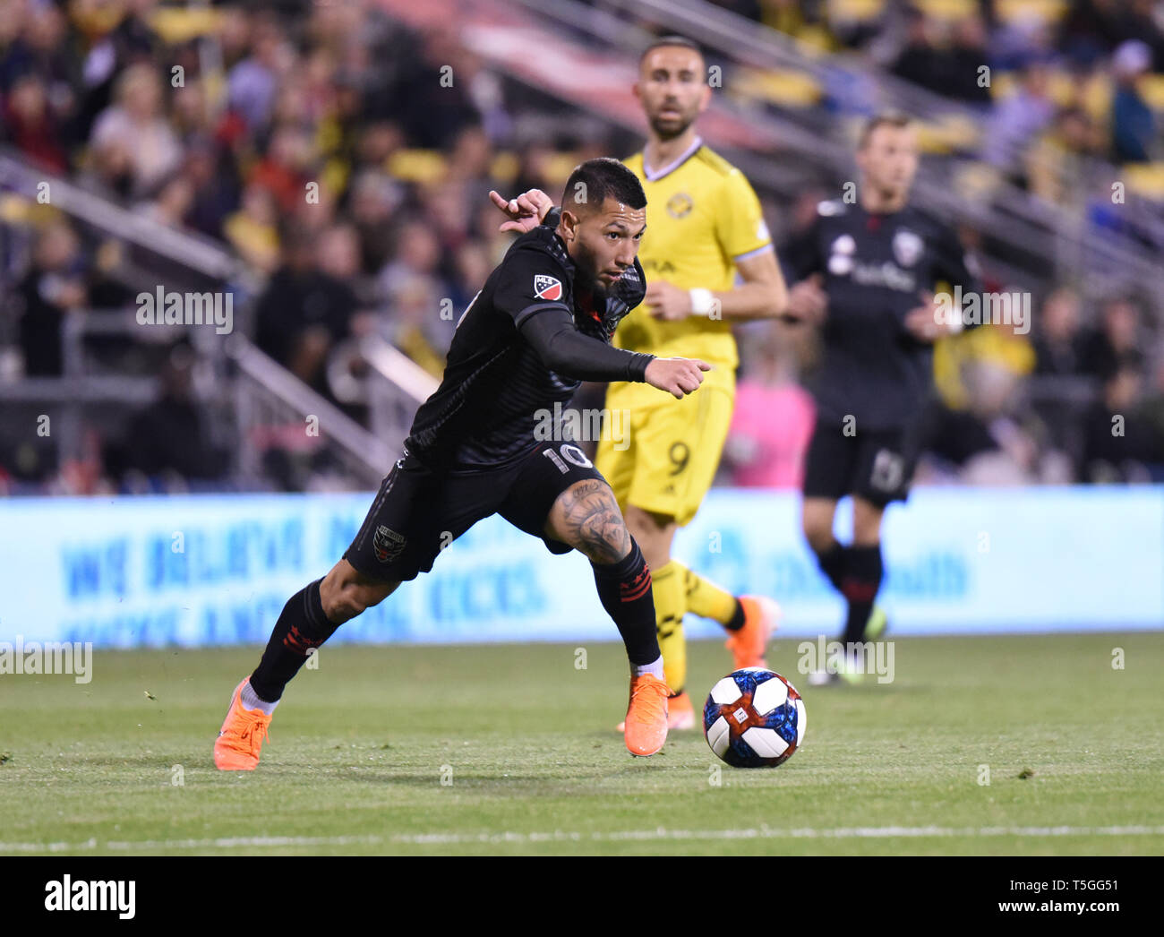 Columbus, OH, USA. 24th Apr, 2019. April 24, 2019: D.C. United midfielder Luciano Acosta (10) eludes defenders during the MLS match between DC United and Columbus Crew SC at Mapfre Stadium in Columbus, Ohio. Austyn McFadden/ZUMA Credit: Austyn McFadden/ZUMA Wire/Alamy Live News Stock Photo
