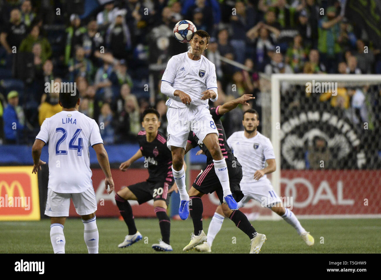 Seattle, Washington, USA. 24th Apr, 2019. Chris Wondolowski (8) goes up for a ball as the San Jose Earthquakes visit the Seattle Sounders in a MLS match at Century Link Field in Seattle, WA. Credit: Jeff Halstead/ZUMA Wire/Alamy Live News Stock Photo