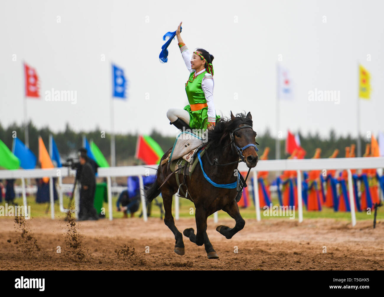 Inner Mongolia, China's Inner Mongolia Autonomous Region. 24th Apr, 2019. A woman performs horse riding at the Genghis Khan Chagan Suluk Nadam Fair in Ejin Horo Banner of Ordos City, north China's Inner Mongolia Autonomous Region, April 24, 2019. The two-day fair kicked off on Wednesday, including a variety of traditional activities. Credit: Peng Yuan/Xinhua/Alamy Live News Stock Photo