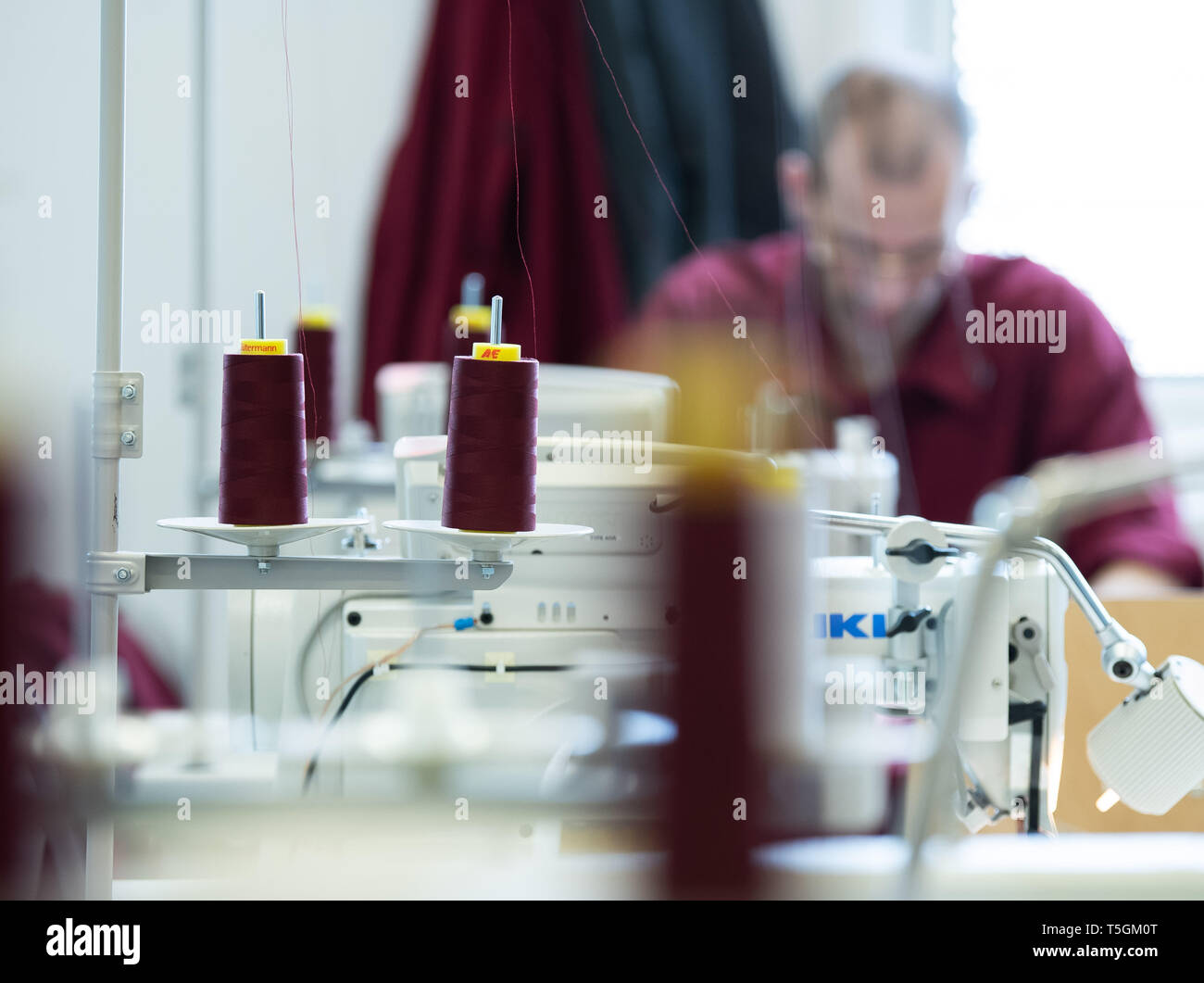25 April 2019, Hessen, Weiterstadt: A prisoner is sewing in the dressmaker's workshop of Weiterstadt Prison. Within the framework of an EU-funded project in the JVA Weiterstadt, measures for social integration are supported. Photo: Silas Stein/dpa Stock Photo