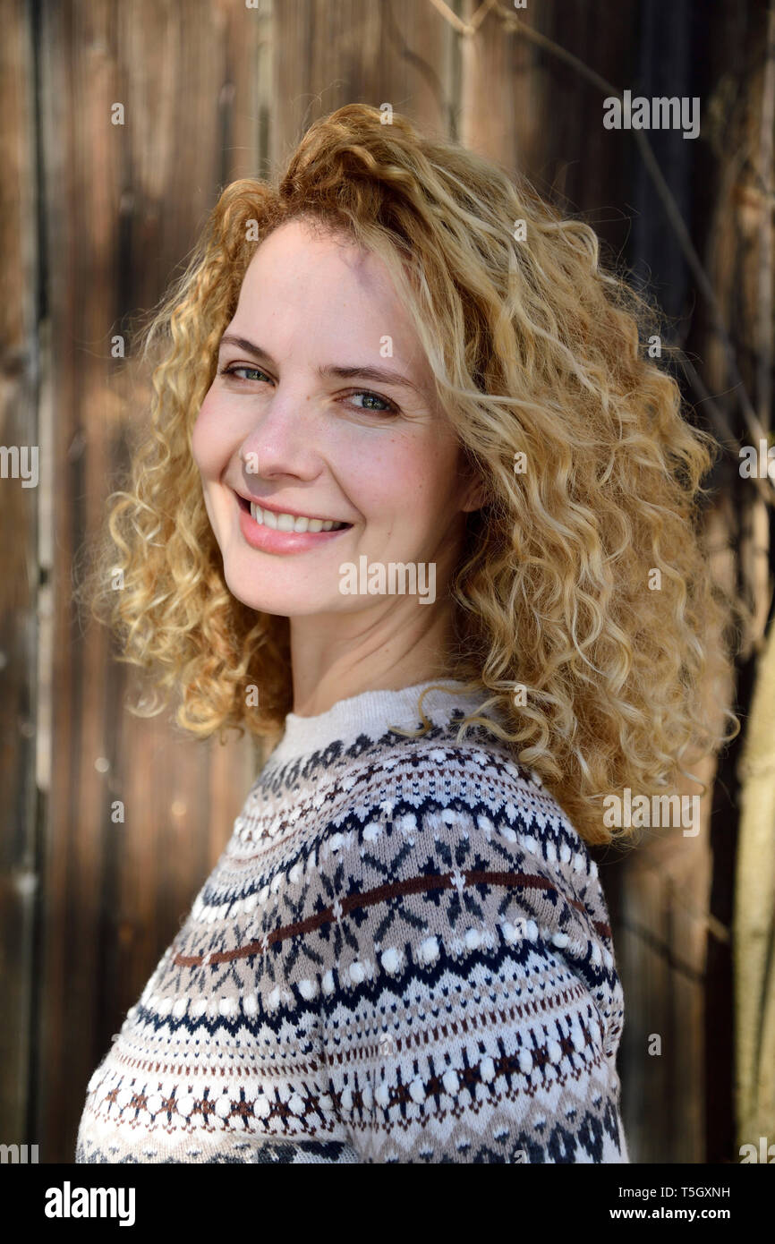 Blonde curly hair woman hi-res stock photography and images - Alamy