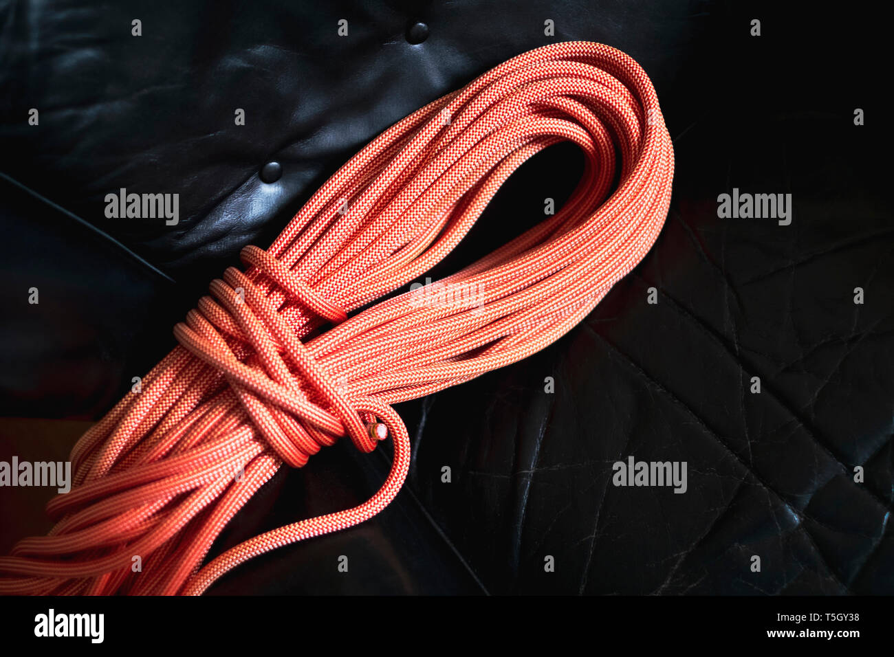 Climbing rope on black leather background Stock Photo
