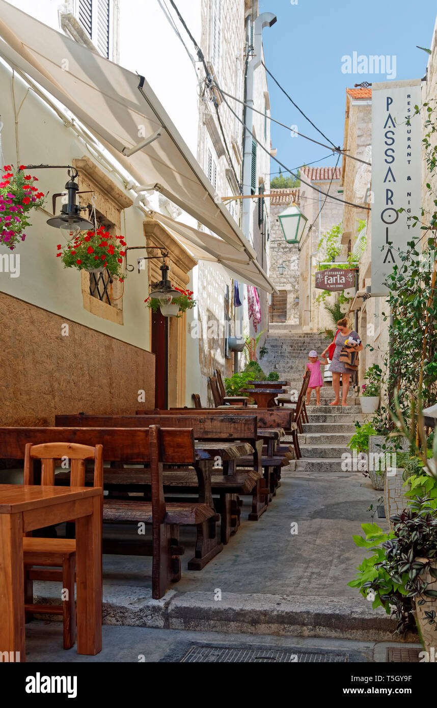 narrow-pedestrian-step-street-old-buildings-shops-outdoor-eating