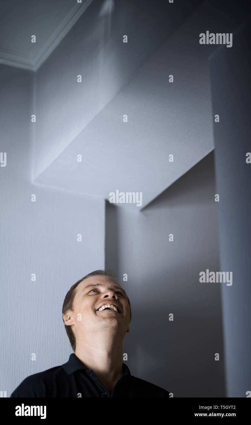Laughing man looking up Stock Photo