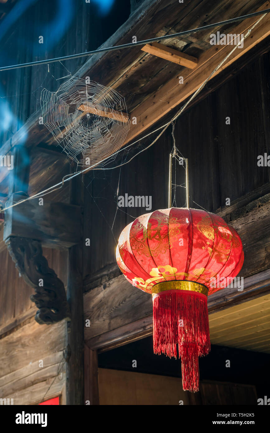 Chinese red lantern hanging from a roof Stock Photo - Alamy