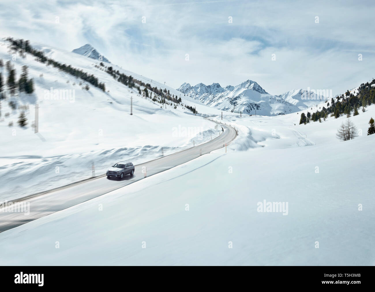 Austria, Tyrol, Sellrain Valley, Kuehtai, Car on mountain road in winter Stock Photo
