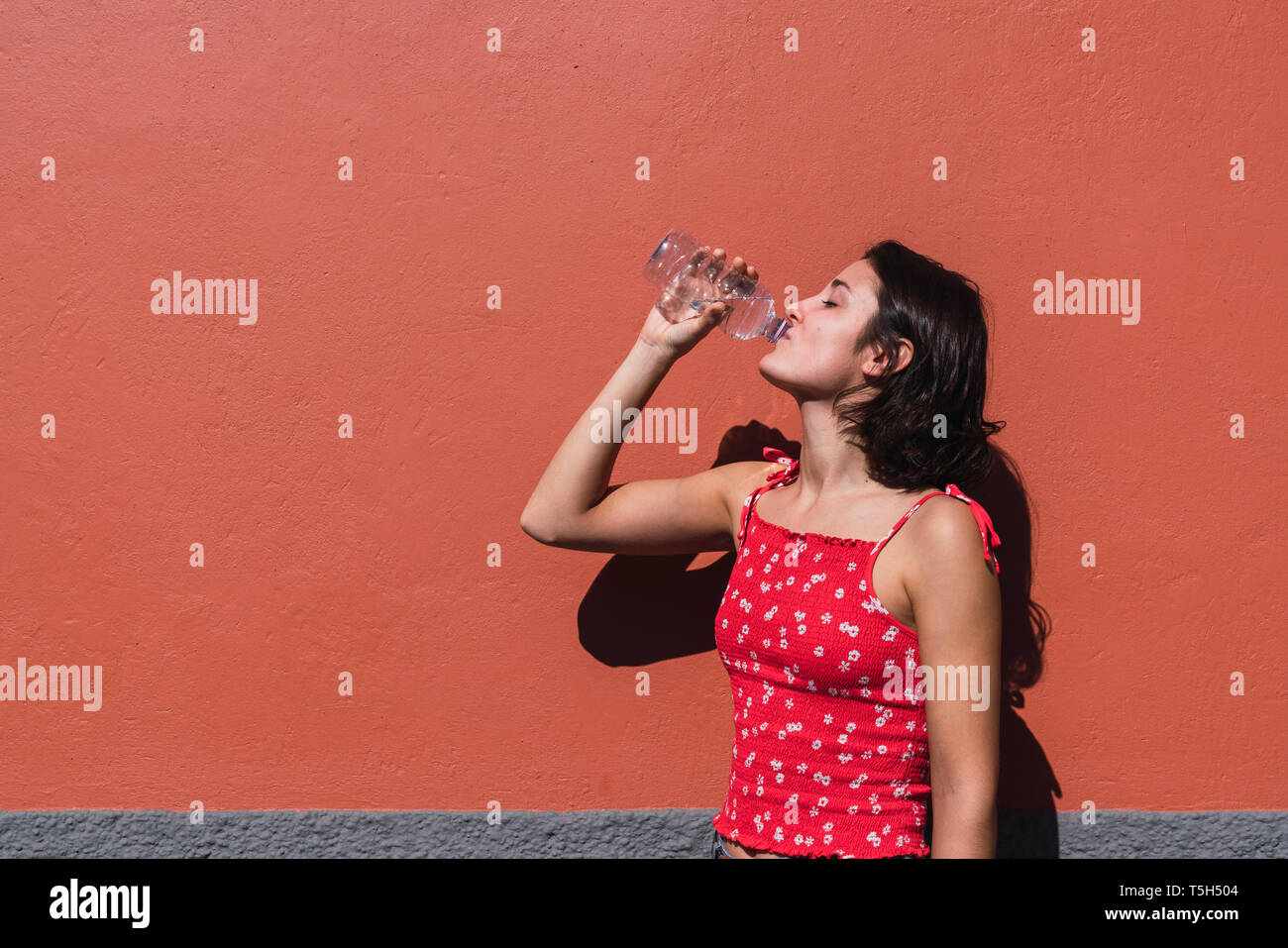 Young woman drinking water Stock Photo