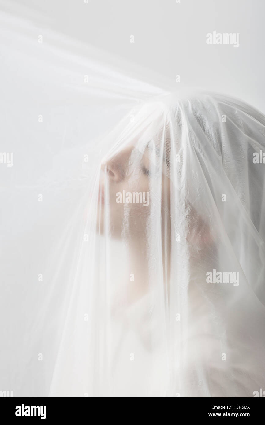 Graceful woman trapped in a veil Stock Photo