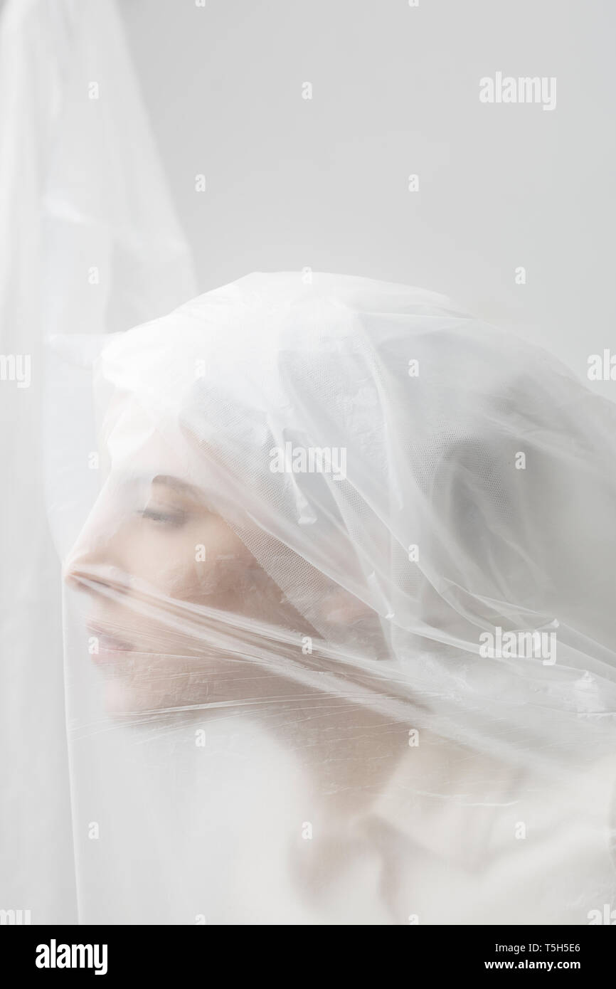 Graceful woman trapped in a veil Stock Photo