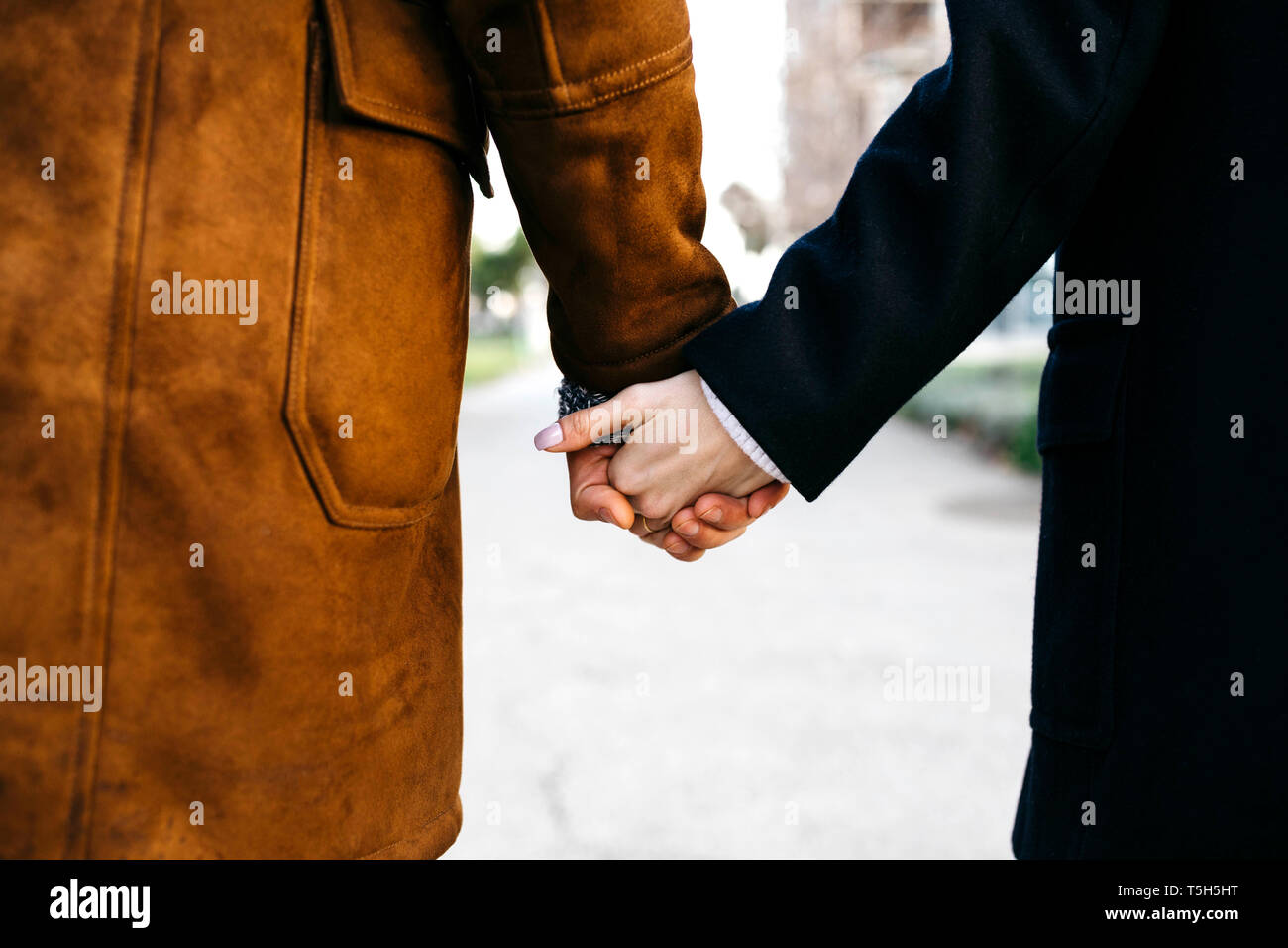Close-up of couple holding hands Stock Photo