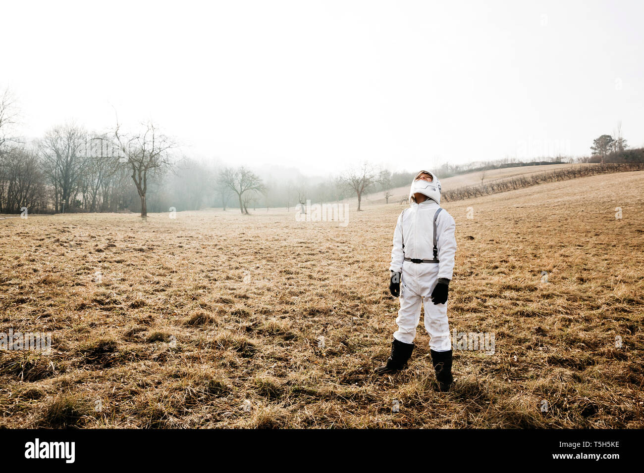 Boy wearing white space suit Stock Photo