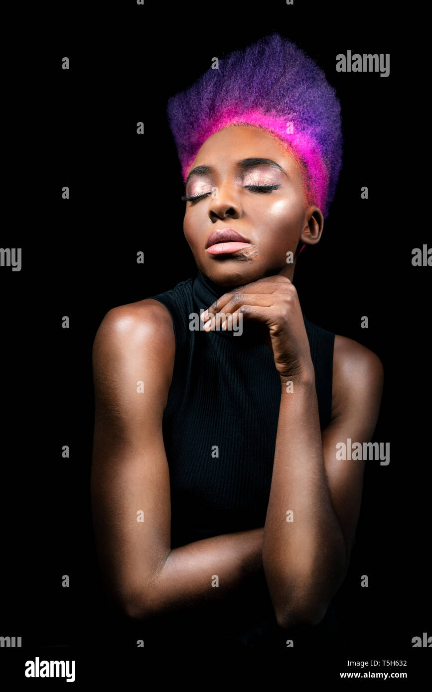 Portrait Of Eccentric Young Woman With Pink And Purple Dyed Hair