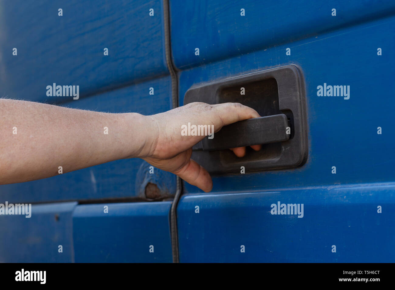 Hand opens door of a truck Stock Photo Alamy