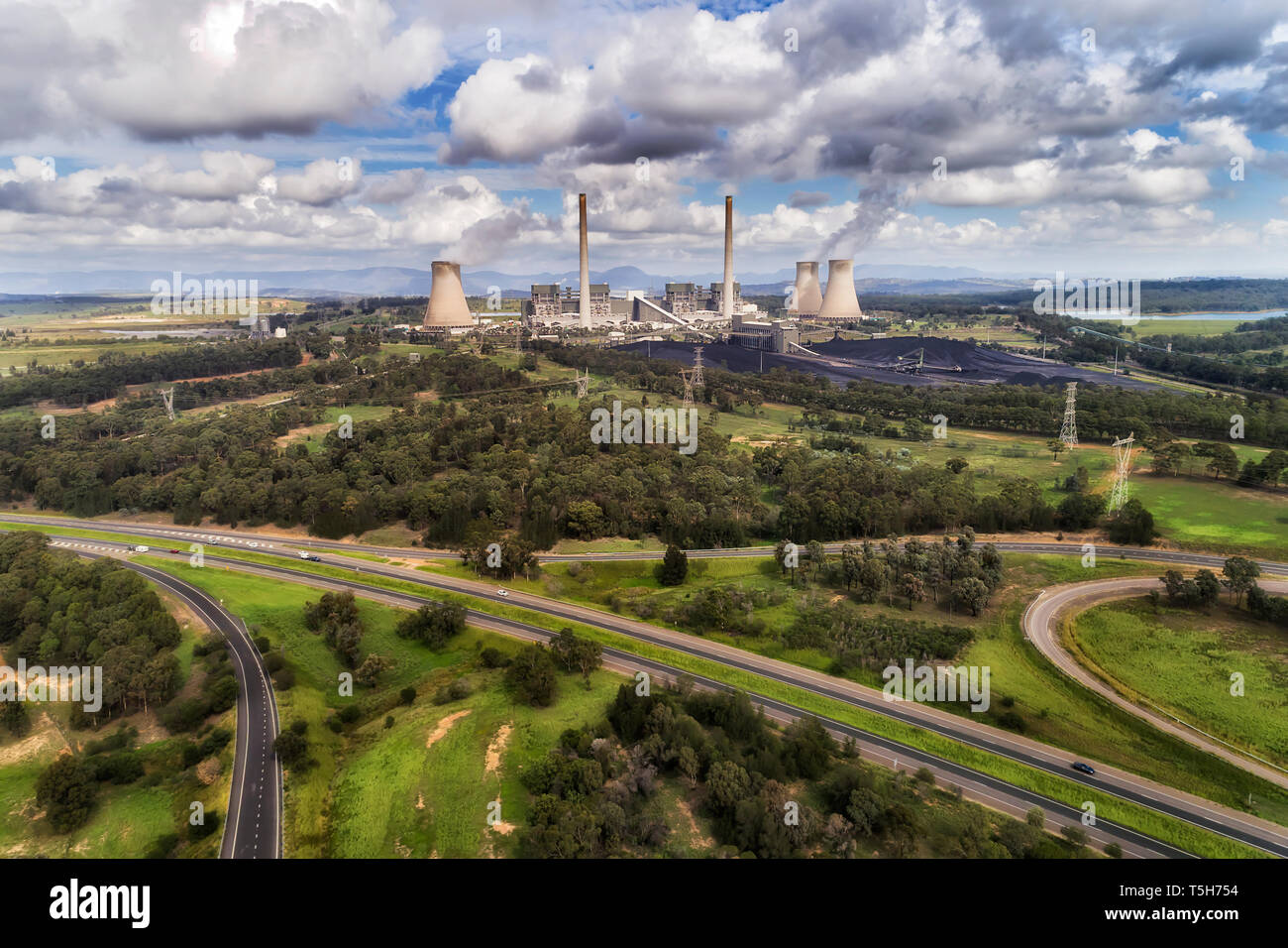 Bayswater power plant in Australian Upper Hunter Valley generating electricity from fossil fuel black coal emitting carbon dioxide into atmosphere on  Stock Photo