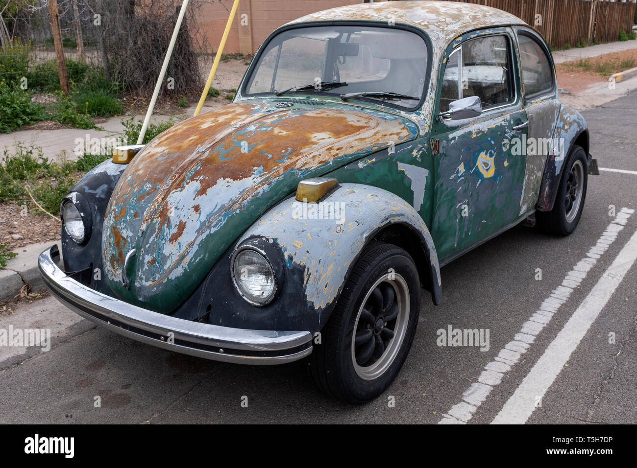 rusted, unpainted Volkswagen Bug or VW Beetle Stock Photo