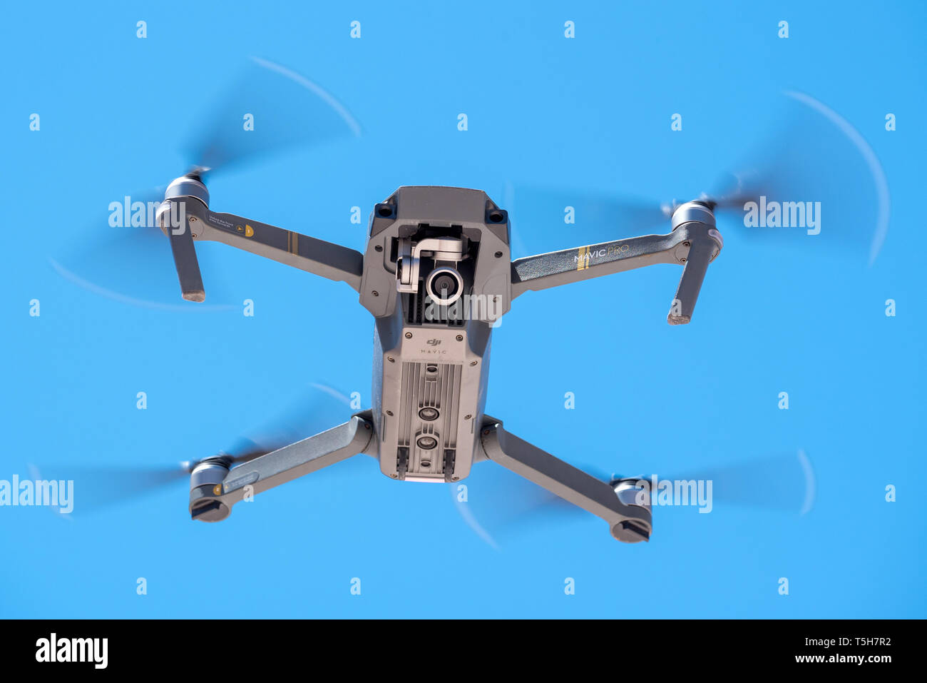 Quadcopter drone in flight. Stock Photo