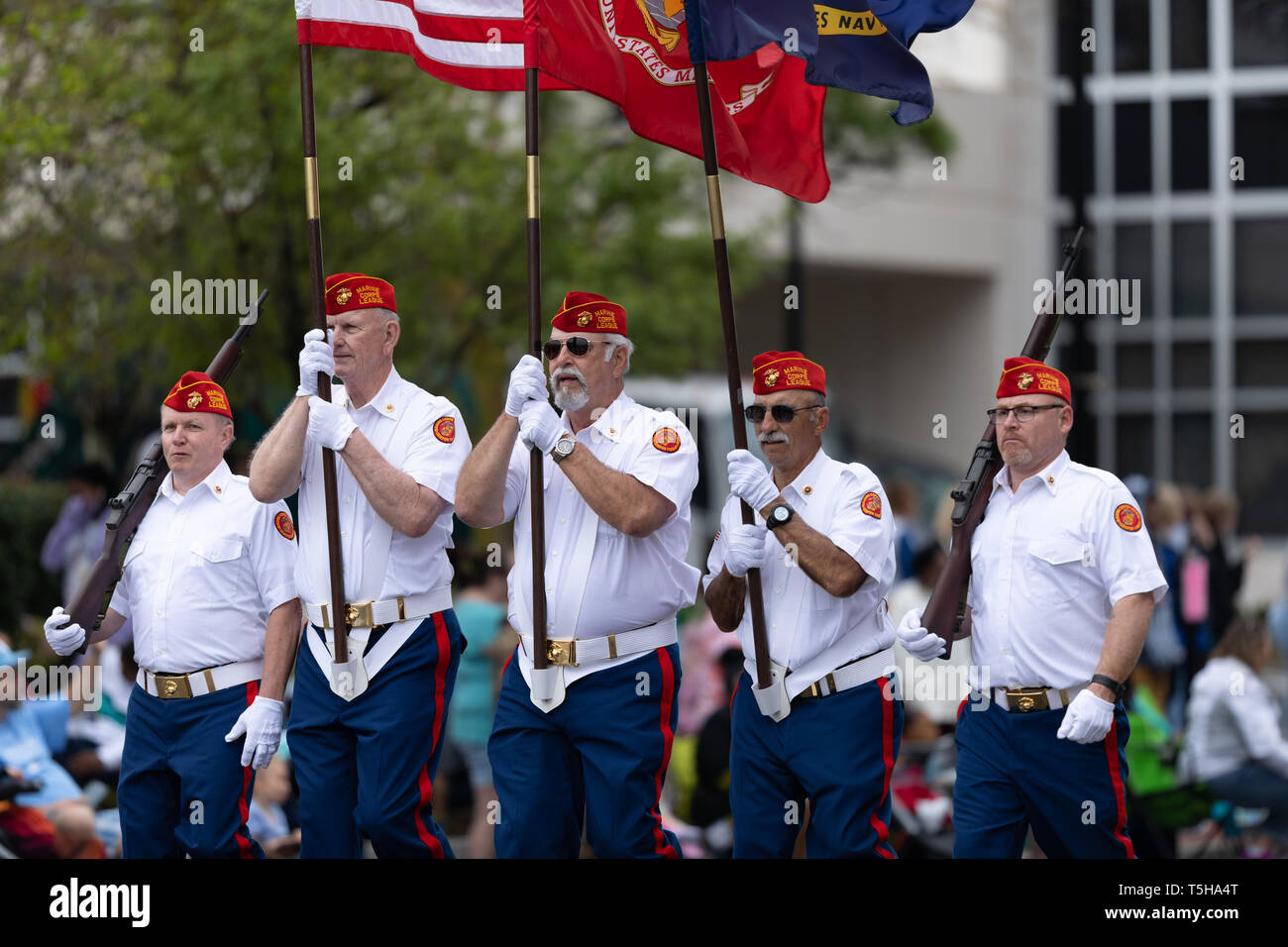 Wilmington, North Carolina, USA - April 6, 2019: The North Carolina Azalea Festival, Members of the Marine Corps League, marching down 3rd street carr Stock Photo