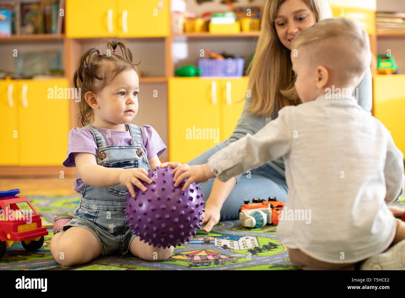 Play fight children teacher hi-res stock photography and images - Alamy