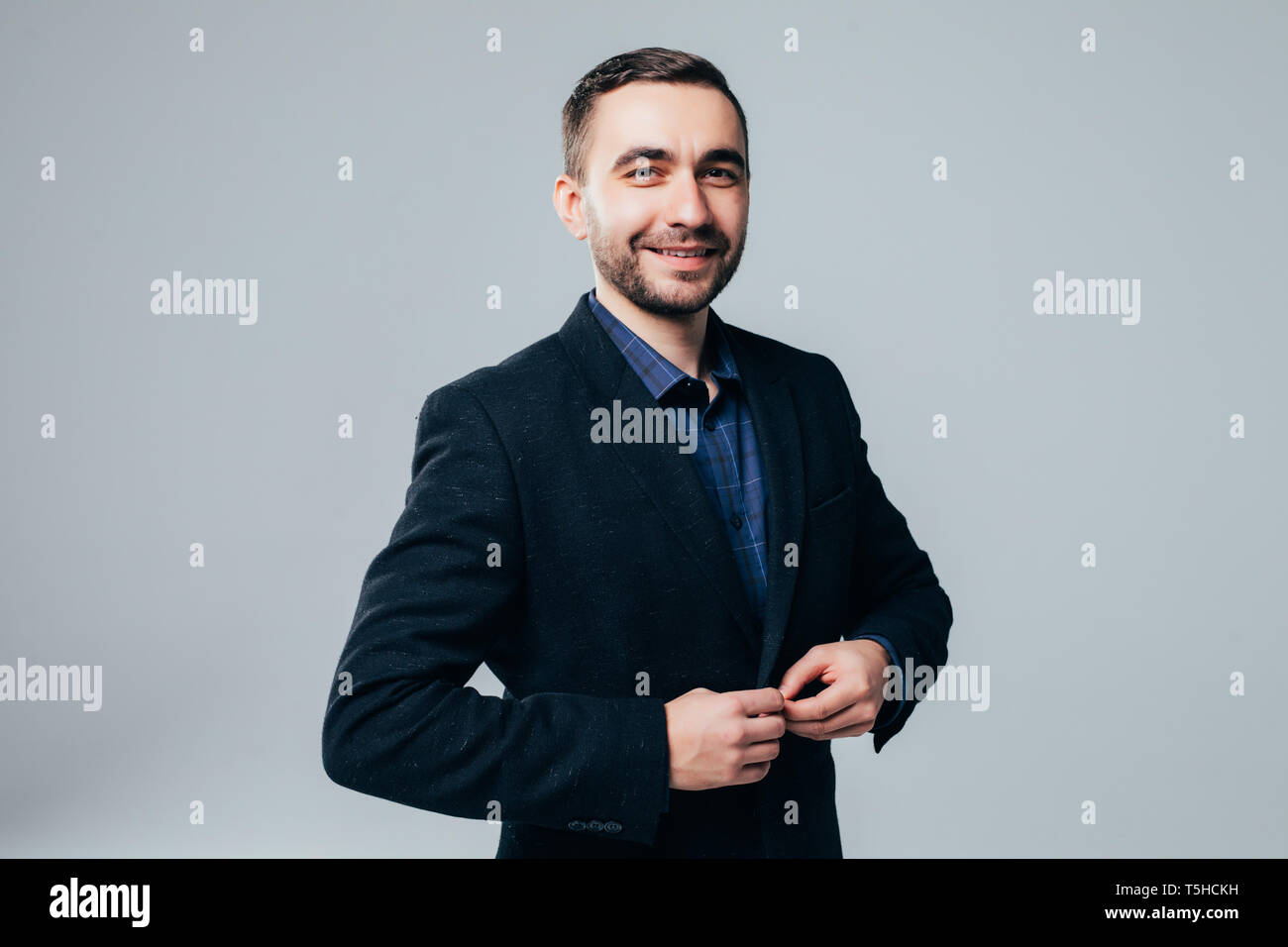 Portrait of handsome man in black suit Stock Photo - Alamy