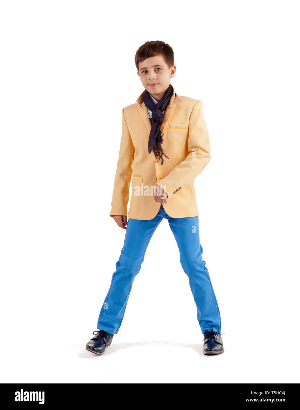 Kids fashion. Boy in an elegant jacket and pants isolated on white background. Businessman boy. Stock Photo