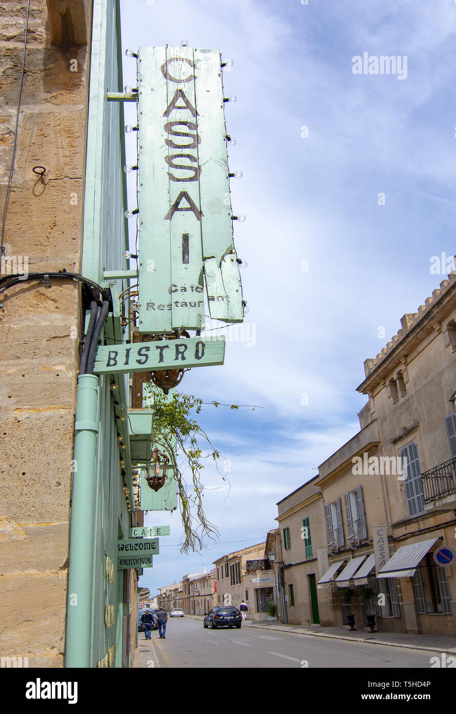 SES SALINES, MALLORCA, SPAIN - APRIL 15, 2019: Cozy Bar and restaurant Cassai exterior street view and interior details in central city on an overcast Stock Photo