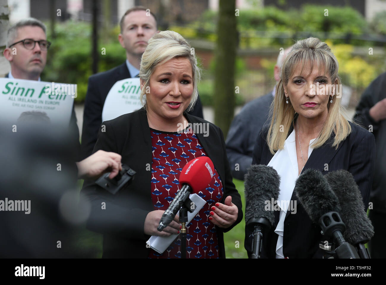 Sinn Fein deputy leader Michelle O'Neill (left) speaks to the media outside the Electoral Office for Northern Ireland after Martina Anderson (right) handed in her nomination papers to run in the European elections. Stock Photo