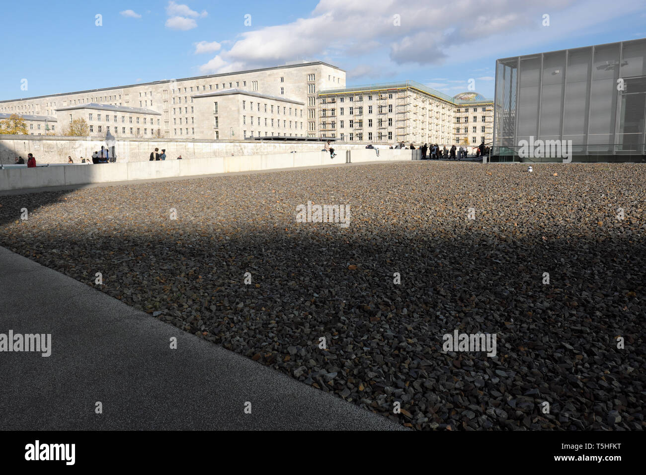 Berlin Germany - visitors to Topography of Terror museum view the Nazi era cellars at the former Gestapo HQ site - behind is former Nazi Air Ministry Stock Photo