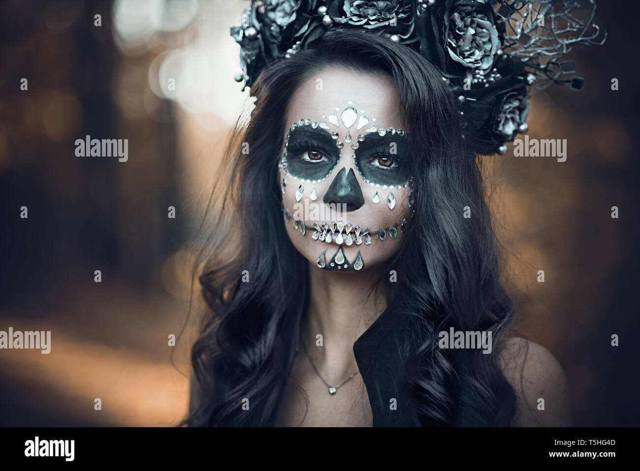 Closeup portrait of Calavera Catrina in black dress. Sugar skull makeup. Dia  de los muertos. Day of The Dead. Halloween Stock Photo - Alamy