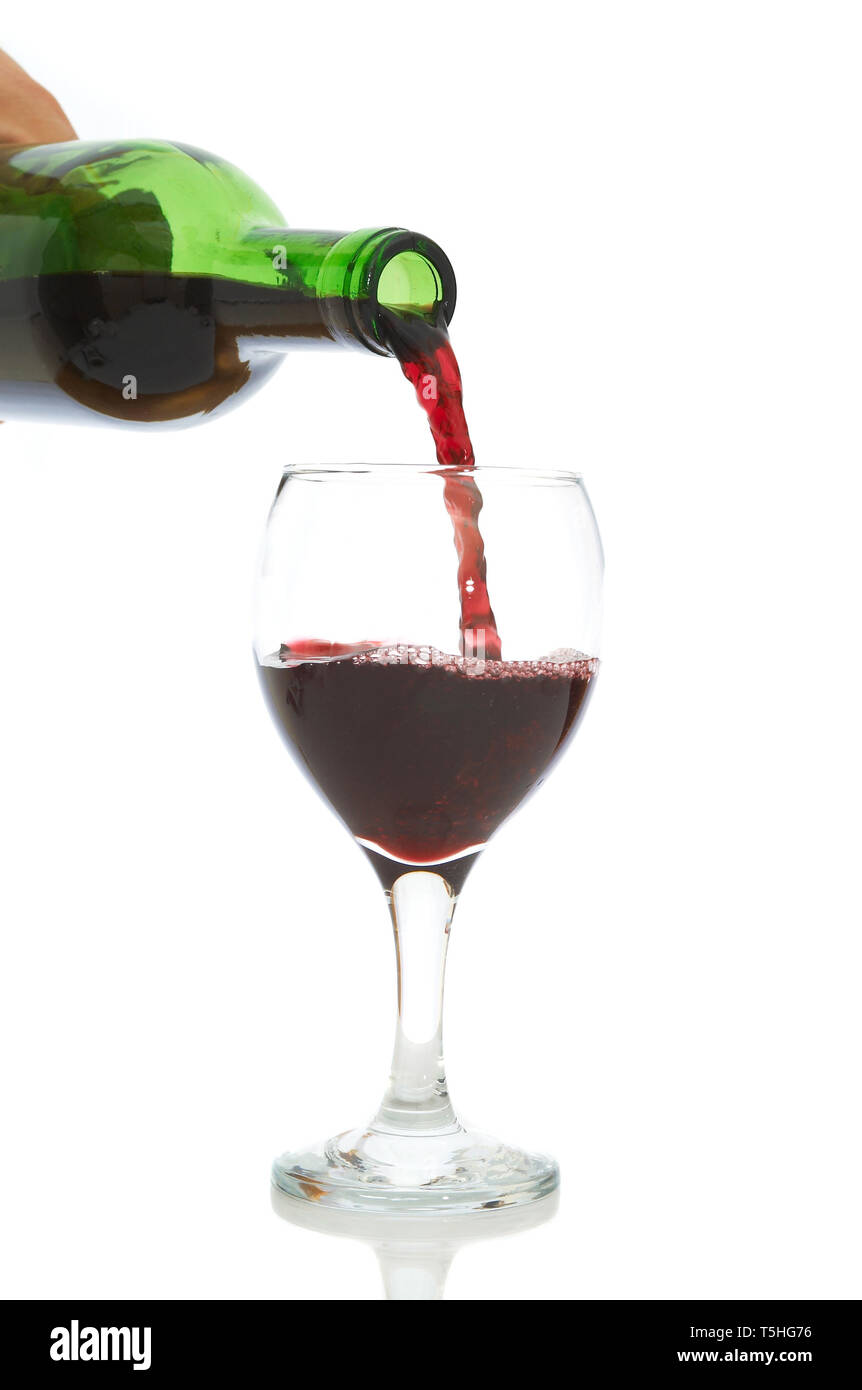 serving red wine to the glass on white background Stock Photo Alamy