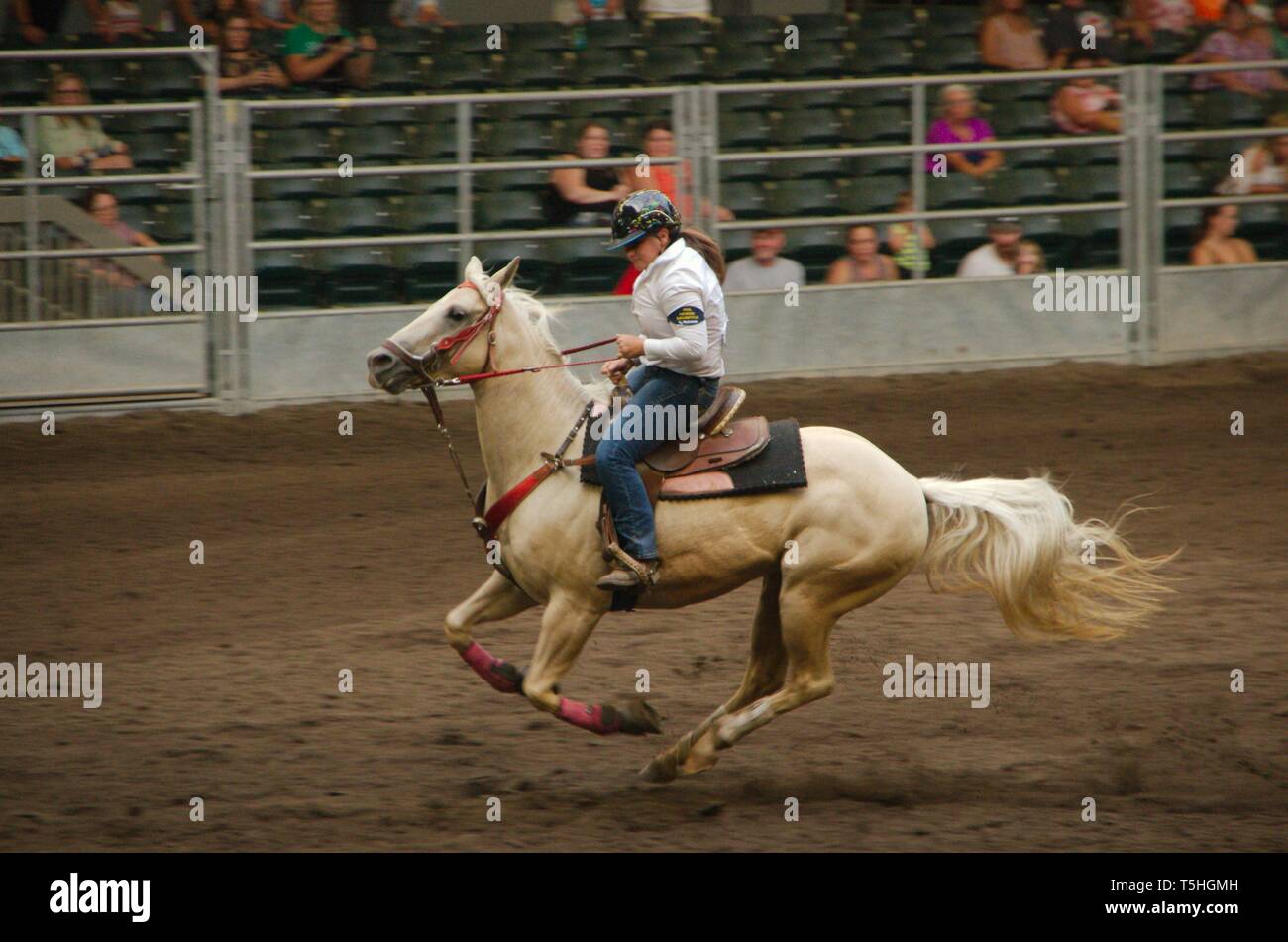 Female horse rider at a rodeo competition at the Iowa State Fair. Stock Photo