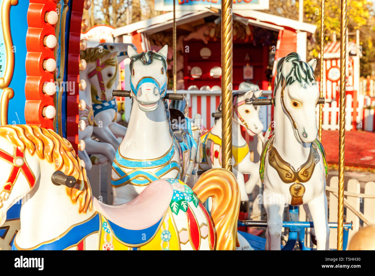 Children outdoor colourful vintage Merry-Go-Round flying horse carousel ...