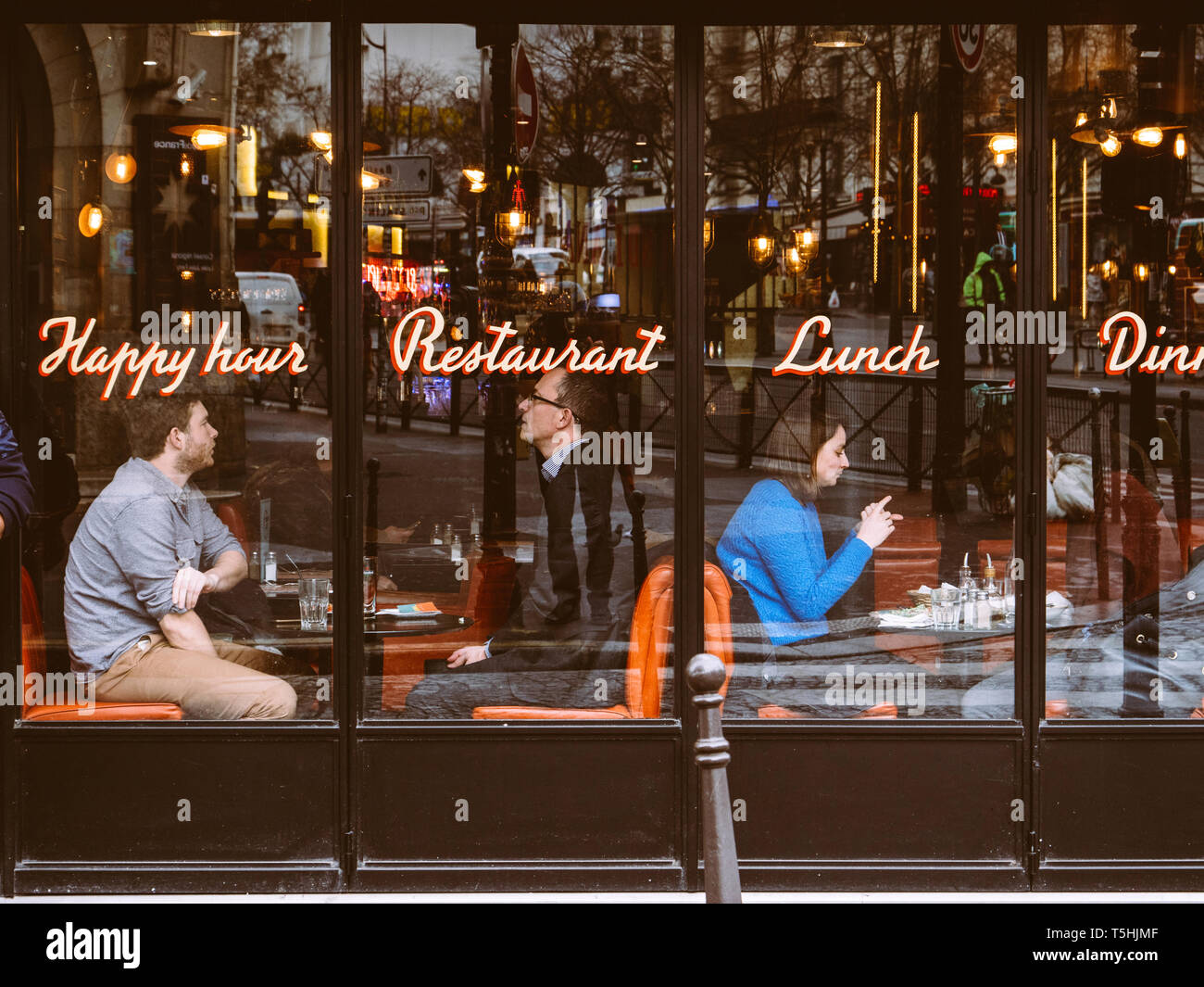 Paris, France Jan 30, 2018 Four people seen sitting inside cozy