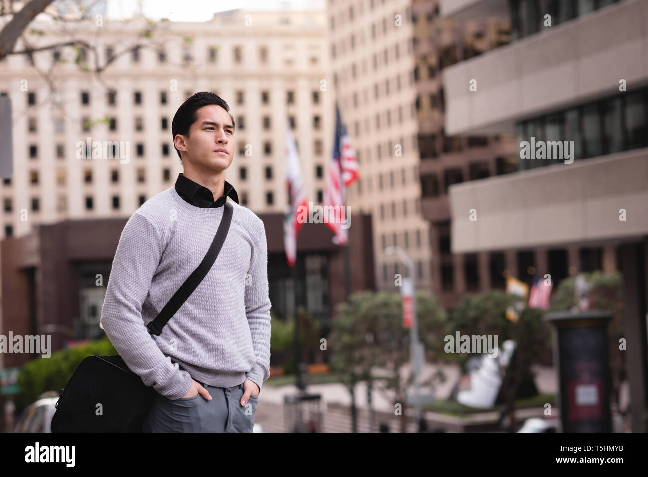 Young man standing in the street hi-res stock photography and images ...