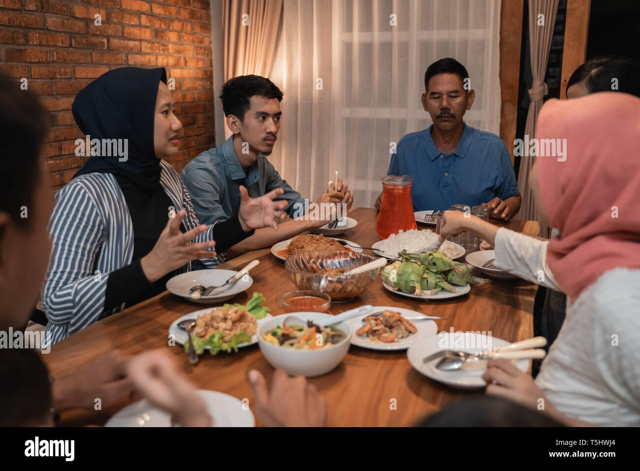 Muslim family dinner hi-res stock photography and images - Alamy