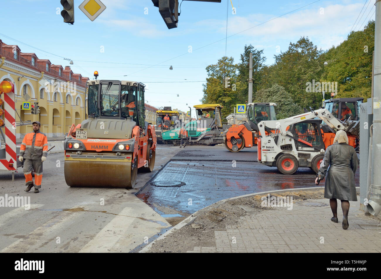 Saint-Petersburg.Russia.October.15.2018.Work is underway on the laying of the road asphalt .Works are carried out in the accelerated mode. Stock Photo