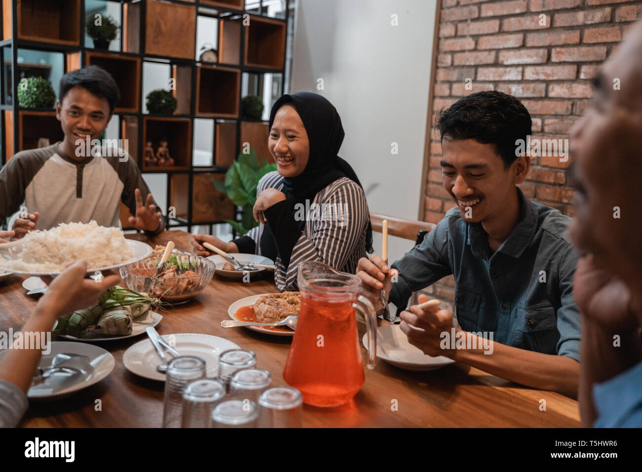 asian muslim family dinner together. break fasting Stock Photo