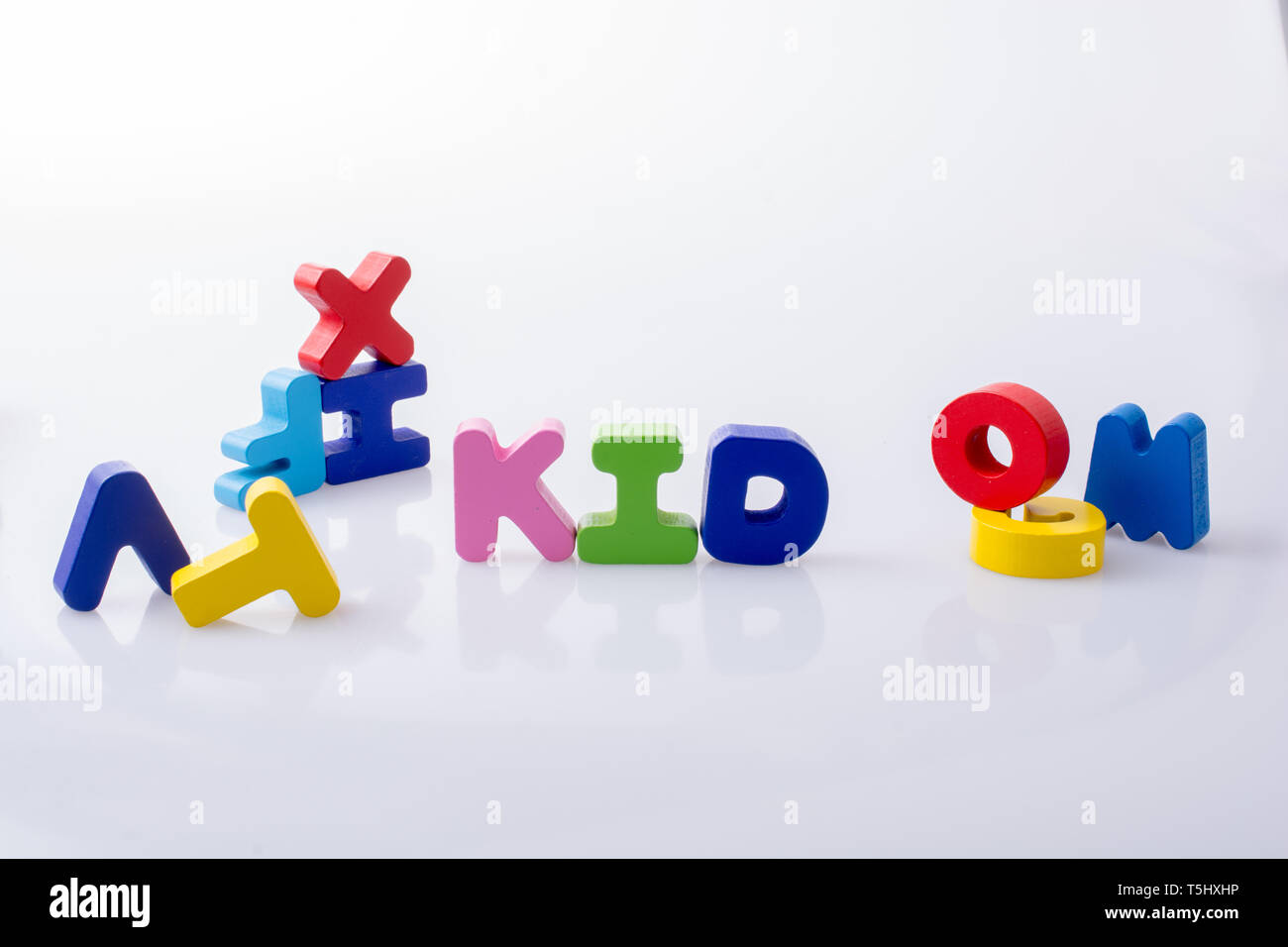 the word KID written with colorful letter blocks on white Stock Photo