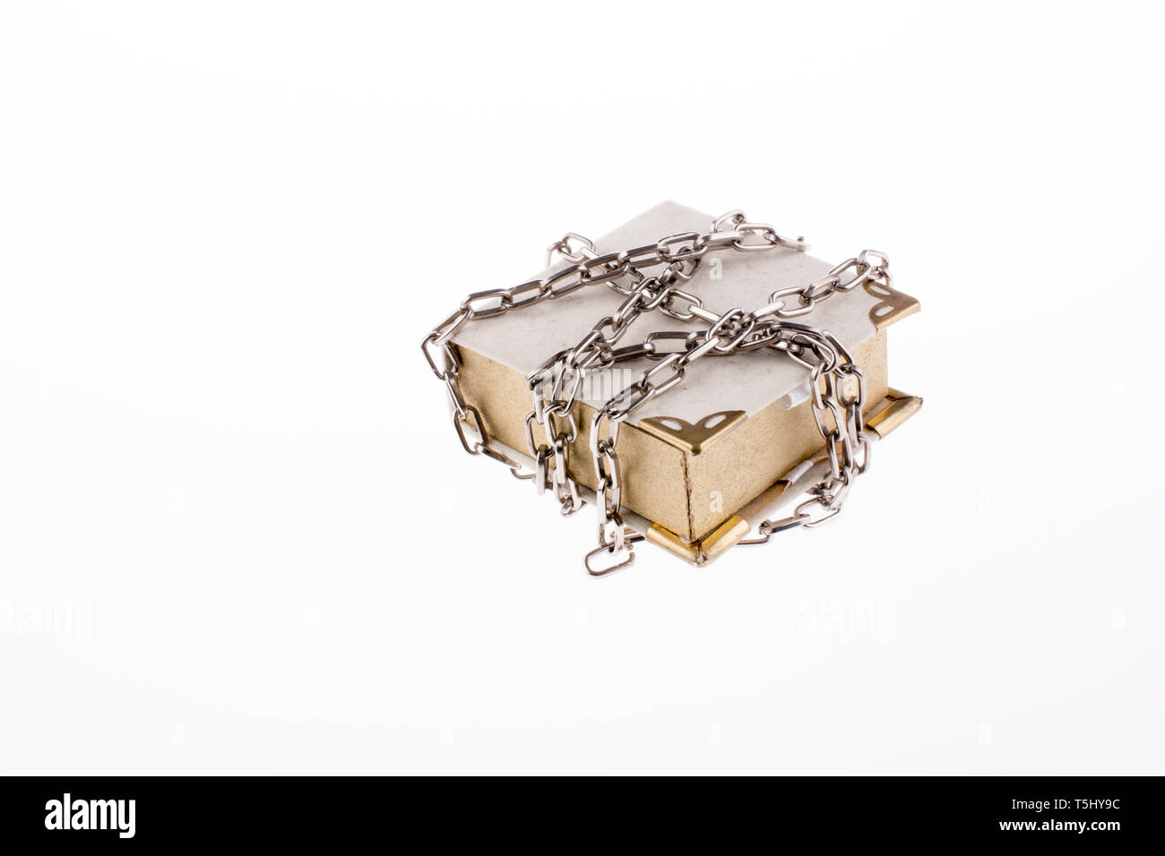 Chained book on white background Stock Photo
