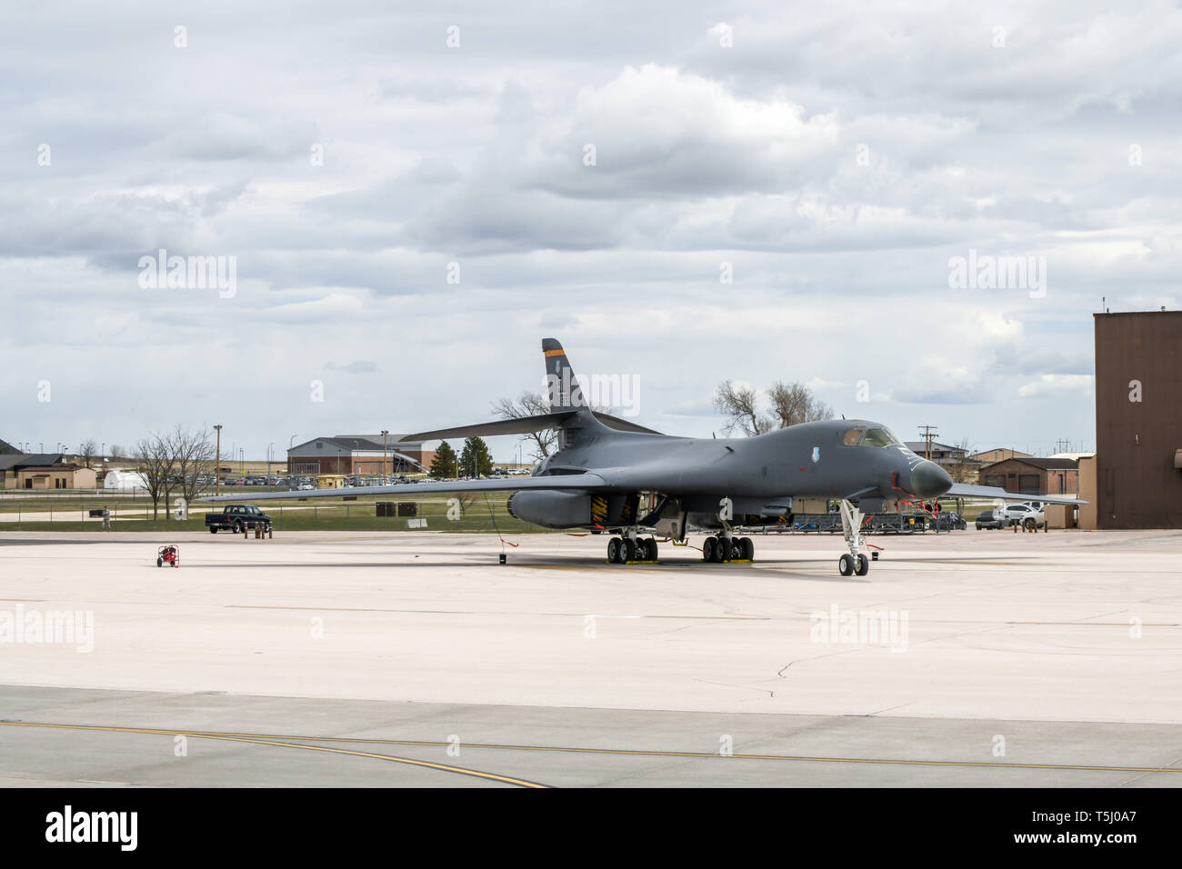 A B-1B Lancer is put on static display by the Pride Hangar at Ellsworth Air Force Base, S.D., April 18, 2019. Ellsworth bombers and a B-25 Mitchell were displayed for the base community to view during an event commemorating the 77th anniversary of the Doolittle Raid. (U.S. Air Force photo by Airman 1st Class Christina M. Bennett) Stock Photo