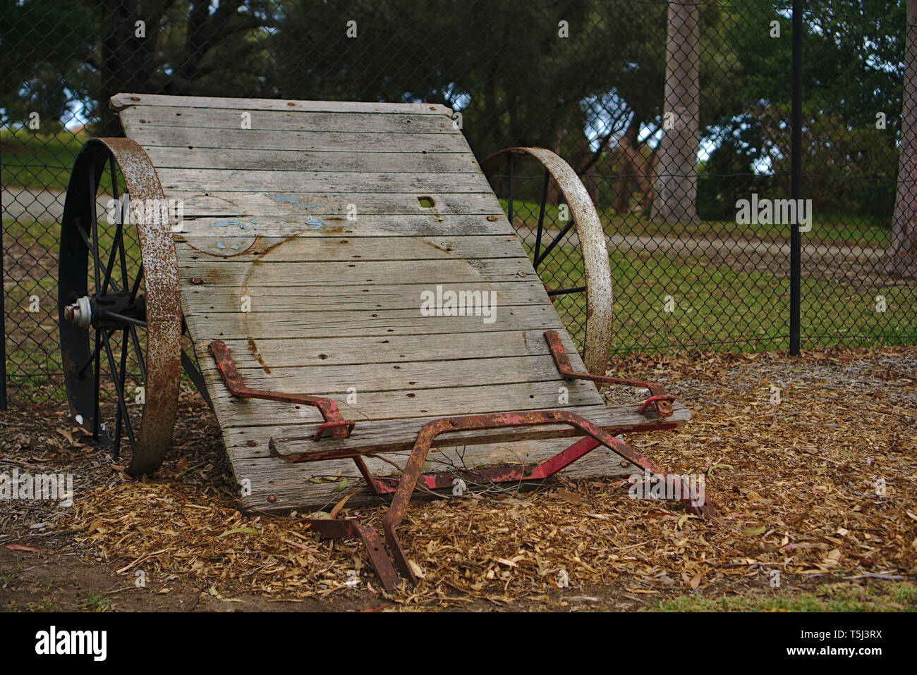 Old abandoned corrosive farm machinery frame Stock Photo